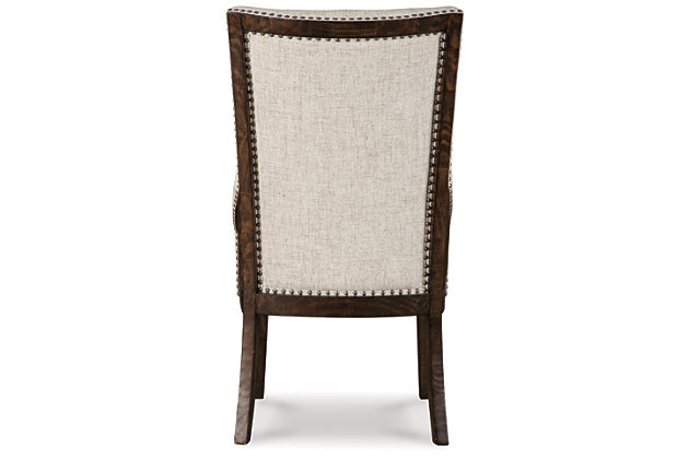 Be the host with the most with the Hillcott upholstered dining room chair. A delicious addition to the modern farmhouse scene, this curvaceous host-style dining chair lures with high-back styling and a sumptuously upholstered button-tufted seat punctuated with nailhead trim that's right on trend.Made of wood | Light beige polyester upholstery over foam cushioned seat | Dark brown distressed finish | Nailhead trim | Assembly required | Estimated Assembly Time: 30 Minutes