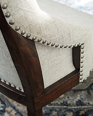 Be the host with the most with the Hillcott upholstered dining room chair. A delicious addition to the modern farmhouse scene, this curvaceous host-style dining chair lures with high-back styling and a sumptuously upholstered button-tufted seat punctuated with nailhead trim that's right on trend.Made of wood | Light beige polyester upholstery over foam cushioned seat | Dark brown distressed finish | Nailhead trim | Assembly required | Estimated Assembly Time: 30 Minutes