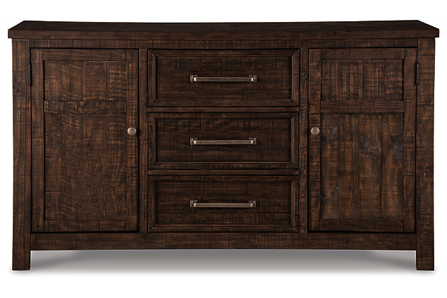 With its lively, dark brown distressed finish, the Hillcott dining room server gives modern farmhouse styling a rich, substantial sensibility. Its sturdy silhouette is beautified with crossbuck detailing and a framed herringbone inlay top that’s truly outstanding. Thick utilitarian bar pulls are paired with round knobs for an interesting mix. Dual cabinets and a trio of smooth-gliding drawers offer a proper place for everything from plates and bowls to utensils and linens.Made of veneers, wood and engineered wood | Dark brown distressed finish | 3 smooth-gliding drawers with dovetail construction | 2 cabinets, each with adjustable shelf | Aged steel-color hardware | Assembly required