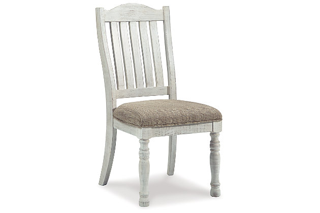 Have your fill of modern farmhouse style with the Havalance upholstered dining chair. Distressed vintage white finish is utterly charming. Bent slat back design and cushioned upholstered seat with woven oatmeal-tone fabric cater with beauty and comfort.Made of wood and engineered wood | Distressed vintage white finish | Foam cushioned seat with polyester oatmeal-color fabric | Assembly required | Estimated Assembly Time: 30 Minutes
