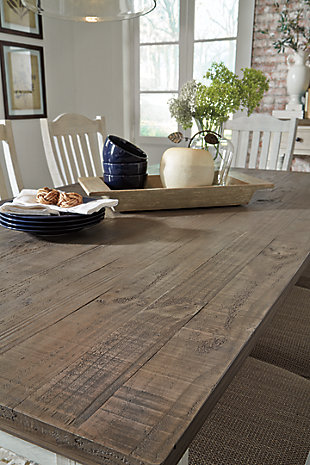 Have your fill of modern farmhouse style with the Havalance 10-piece dining set. Distressed, vintage-style finishes blend weathered neutrals for an utterly charming effect. The table boasts robust legs for a hearty, substantial look while the bent slat back design and cushioned upholstered seat of the dining chairs cater to your aesthetic. Sturdy posts and thick mouldings lend substance to the drawer and cabinet storage and reversible wine rack/shelves offered by the dining server.Includes dining table, dining server and 8 dining side chairs | Table and server made of pine wood, pine veneer and engineered wood with two-tone distressed finish: weathered gray top; vintage white base | Table seats 6-8 | Server with 2 reversible wine rack/shelves, 3 smooth-gliding drawers (with felt lining) and double-door cabinet with single-shelf storage | Server with aged iron-tone hardware | Chairs made of wood and engineered wood with foam cushioned seat upholstered in polyester oatmeal-color fabric | Distressed vintage white finish | Assembly required | Estimated Assembly Time: 315 Minutes