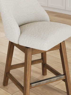Side view of a white upholstered bar stool showing tall back and wooden legs