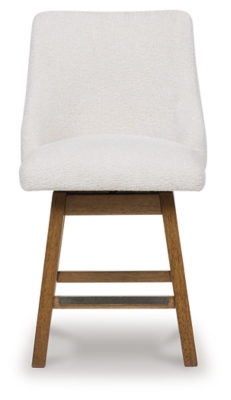 Close-up of the wooden leg and footrest of a white upholstered bar stool