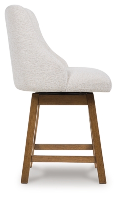 Back view of a white upholstered bar stool showing wooden legs