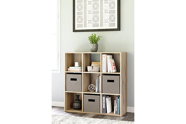 Organize in style with the Vaibryn nine-cube organizer. With a warm brown finish, it’s easy to keep your clutter managed while your aesthetic remains crisp and clean. Made with engineered wood (MDF/particleboard) and decorative laminate | Warm brown finish over replicated elm wood grain | Accommodates any 10.5" W x 10.5" D x 11" H storage bin | Assembly required | Estimated Assembly Time: 25 Minutes