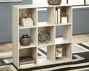 Bringing big style to small living areas, the Socalle nine-cube organizer is a smart, space-saving choice for those with an eye for contemporary design. Its clean-lined profile creates such a simple silhouette that works in so many settings. What a pretty and practical addition to open-concept living.Made with engineered wood (MDF/particleboard) and decorative laminate | Light natural finish over replicated oak grain with authentic touch | Accommodates any 10.5" W x 10.5" D x 11" H storage bin | Assembly required | Estimated Assembly Time: 25 Minutes