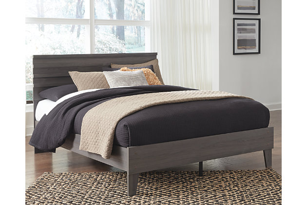 With clean lines evoking a mid-century modern mood, the Brymont queen panel platform bed is designed to bring harmony to your bedroom retreat. Finished in a warm gray that enhances the soothing sensibility.Complete queen bed-in-a-box (mattress not included) | Includes headboard and platform bed | Made with engineered wood (MDF/particleboard) and decorative laminate | Warm gray finish over replicated walnut wood grain with authentic touch | Bed does not require a foundation/box spring | Mattress available, sold separately | Assembly required | Estimated Assembly Time: 50 Minutes