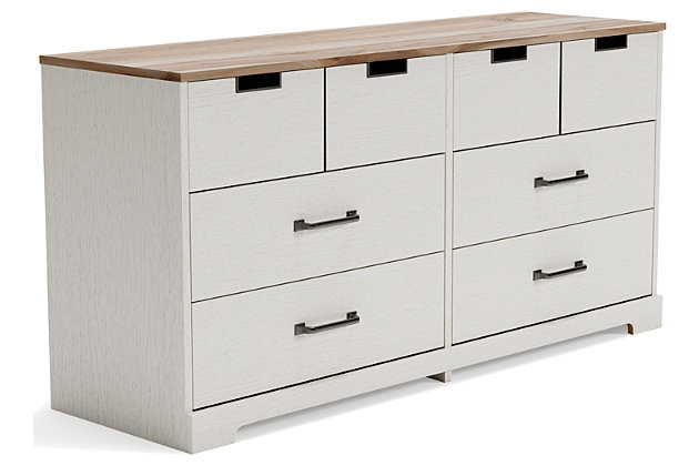 Fresh and inviting, the Vaibryn 6-drawer dresser is truly versatile. A crisp white painted finish with a subtle replicated wood grain brings light to your room, while a warm brown finish accents the top. Design details include metal cut-out openings along the upper drawers, with the lower drawers paired with metal handles in an antiqued nickel-tone finish. Six smooth-gliding drawers provide plenty of storage, so there's no excuse for a messy room.Made of engineered wood and decorative laminate | White painted finish with subtle replicated wood grain | Top with warm brown finish over replicated elm wood grain | 6 smooth-gliding drawers with vinyl-wrapped sides and back | Top drawers with metal detailed openings | Lower drawers with metal handles in antiqued nickel-tone finish | Safety is a top priority, clothing storage units are designed to meet the most current standard for stability, ASTM F 2057 (ASTM International) | Drawers extend out for maximum interior access while maintaining safety | Assembly required | Estimated Assembly Time: 50 Minutes