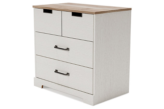Fresh and inviting, the Vaibryn 3-drawer chest is truly versatile. A crisp white painted finish with a subtle replicated wood grain brings light to your room, while a warm brown finish accents the top. Design details include metal cut-out openings along the upper drawer, with the lower drawers paired with metal handles in an antiqued nickel-tone finish. Three smooth-gliding drawers provide plenty of extra storage, so there's no excuse for a messy room.Made of engineered wood | White painted finish with subtle replicated wood grain; Made of engineered wood and decorative laminate | White painted finish with subtle replicated wood grain | Top with warm brown finish over replicated elm wood grain | 3 smooth-gliding drawers with vinyl-wrapped sides and back | Top drawer with metal detailed openings | Lower drawers with metal handles in antiqued nickel-tone finish | Safety is a top priority, clothing storage units are designed to meet the most current standard for stability, ASTM F 2057 (ASTM International) | Drawers extend out for maximum interior access while maintaining safety | Assembly required | Estimated Assembly Time: 25 Minutes