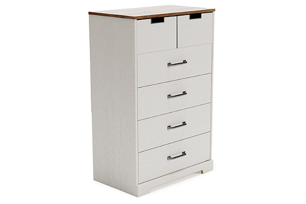 Fresh and inviting, the Vaibryn 5-drawer chest is truly versatile. A crisp white painted finish with a subtle replicated wood grain brings light to your room, while a warm brown finish accents the top. Design details include metal cut-out openings along the upper drawer, with the lower drawers paired with metal handles in an antiqued nickel-tone finish. Five smooth-gliding drawers provide plenty of extra storage, so there's no excuse for a messy room.Made of engineered wood and decorative laminate | White painted finish with subtle replicated wood grain | Top with warm brown finish over replicated elm wood grain | 5 smooth-gliding drawers with vinyl-wrapped sides and back | Top drawer with metal detailed openings | Lower drawers with metal handles in antiqued nickel-tone finish | Safety is a top priority, clothing storage units are designed to meet the most current standard for stability, ASTM F 2057 (ASTM International) | Drawers extend out for maximum interior access while maintaining safety | Assembly required | Estimated Assembly Time: 45 Minutes