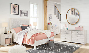 If it’s coastal chic or cottage quaint style you long for, the Paxberry whitewashed dresser invites you to go to town. Its distinctive weatherworn finish conveys an easy-breezy sensibility, perfect for a restful bedroom retreat. Tastefully edited lines and medallion drawer pulls give this attractively priced dresser a high-end aesthetic.Dresser only | Made of engineered wood and decorative laminate | Whitewash replicated worn through paint with authentic touch | Hardware features a worn-through painted effect | 6 spacious smooth-gliding drawers; vinyl wrapped sides and back for extra durability | Safety is a top priority, clothing storage units are designed to meet the most current standard for stability, ASTM F 2057 (ASTM International) | Drawers extend out to accommodate maximum access to drawer interior while maintaining safety | Assembly required | Estimated Assembly Time: 50 Minutes