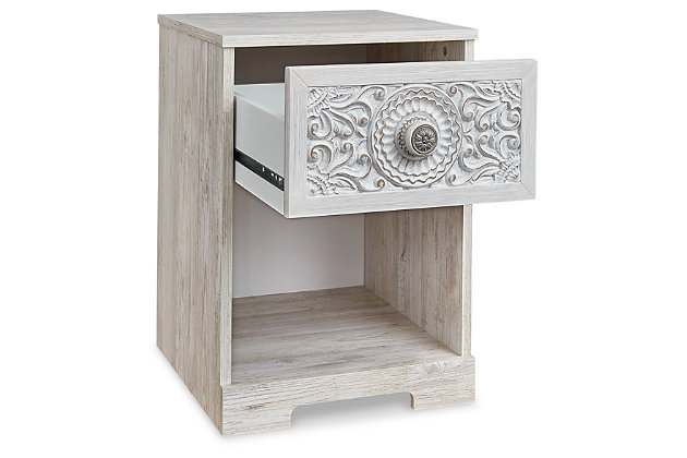 If it’s coastal chic or cottage quaint style you long for, the Paxberry whitewashed nightstand invites you to go to town. Its distinctive weatherworn finish conveys an easy-breezy sensibility, perfect for a restful bedroom retreat. Rest assured, tastefully edited lines and medallion drawer pulls give this attractively priced nightstand a high-end aesthetic.Made with engineered wood (MDF/particleboard) and decorative laminate | Whitewash replicated worn-through paint with authentic touch | Hardware features a worn-through painted effect | Spacious smooth-gliding drawer; vinyl-wrapped sides and back for extra durability; open cubby | Assembly required | Estimated Assembly Time: 15 Minutes