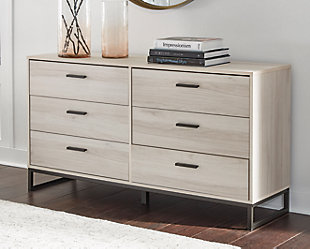 Light and bright, the Socalle dresser is inspired by chic design. A natural finish over replicated oak grain offers an authentic touch to this so-cool piece. Beautifully blend the hues of natural living with the edginess of your modern lifestyle.Made of engineered wood and decorative laminate | Natural finish over replicated oak grain with authentic touch | 6 smooth-gliding drawers | Dark pewter-tone pulls | Vinyl wrapped drawer sides and back for extra durability | Safety is a top priority, clothing storage units are designed to meet the most current standard for stability, ASTM F 2057 (ASTM International) | Drawers extend out to accommodate maximum access to drawer interior while maintaining safety | Assembly required | Estimated Assembly Time: 50 Minutes