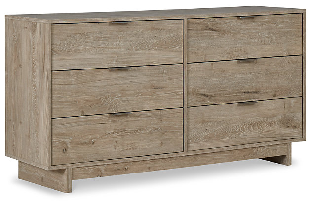 Bringing big style to small living areas, the Oliah dresser is a smart, space-saving choice for those with an eye for contemporary design. Clean-lined profile and understated refinements create such a simple silhouette that works in so many settings. Flush-mount drawers with integrated pulls keeps this dresser on the cutting edge of cool.Made of engineered wood and decorative laminate | Dry, light finish with replicated oak grain and authentic touch | 6 spacious smooth-gliding drawers; vinyl wrapped sides and back for extra durability | Brushed nickel-tone tab pulls | Safety is a top priority, clothing storage units are designed to meet the most current standard for stability, ASTM F 2057 (ASTM International) | Drawers extend out to accommodate maximum access to drawer interior while maintaining safety | Assembly required | Estimated Assembly Time: 40 Minutes