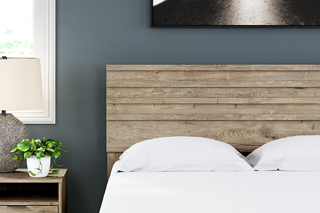 Bringing big style to small living areas, the Oliah queen headboard is a smart, space-saving choice for those with an eye for contemporary design. Its clean-lined profile with understated refinements creates such a simple silhouette that works in so many settings. This easy-to-love look makes just the right statement.Headboard only | Made with engineered wood (MDF/particleboard) and decorative laminate | Dry, light finish with replicated oak grain and authentic touch | Hardware not included | ¼" bolts are needed to attach headboard to your existing metal bed frame | Assembly required | Estimated Assembly Time: 15 Minutes