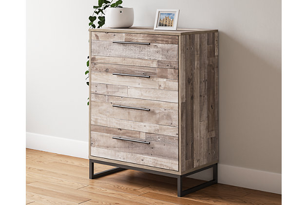 Part beach chic, part urban hip, the Neilsville 4-drawer chest is everything you dreamed of, at a comfortably cool price. The butcher block whitewash finish over replicated pine grain lends a richly relaxed aesthetic that suits your sensibility. Dark pewter-tone drawer pulls and sled legs add a high design element. What an easy-breezy choice for a naturally beautiful bedroom retreat.Made of engineered wood and decorative laminate | Butcher block, whitewash finish over replicated pine grain with authentic touch | Dark pewter-tone hardware and metal sled legs | 4 smooth-gliding drawers | Vinyl wrapped drawer sides and back for durability | Safety is a top priority, clothing storage units are designed to meet the most current standard for stability, ASTM F 2057 (ASTM International) | Drawers extend out to accommodate maximum access to drawer interior while maintaining safety | Assembly required | Estimated Assembly Time: 30 Minutes