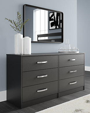 Practical and attractive, the Finch 6-drawer dresser blends seamlessly with modern decor and makes a smart addition to a bedroom. The six full-sized drawers slide easily and can be used to keep your clothes neat and organized. Sleek metal pulls in a brushed nickel-tone finish add to the streamlined aesthetic. Combine with other pieces in the collection to create a room that’s smart and stylish.Made of engineered wood and decorative laminate | Matte black finish with subtle replicated wood grain | 6 smooth-gliding drawers with ball-bearing construction and safety stops | Vinyl-wrapped drawer sides and back | Brushed nickel-tone hardware | Safety is a top priority, clothing storage units are designed to meet the most current standard for stability, ASTM F 2057 (ASTM International) | Drawers extend out to accommodate maximum access to drawer interior while maintaining safety | Assembly required | Estimated Assembly Time: 50 Minutes
