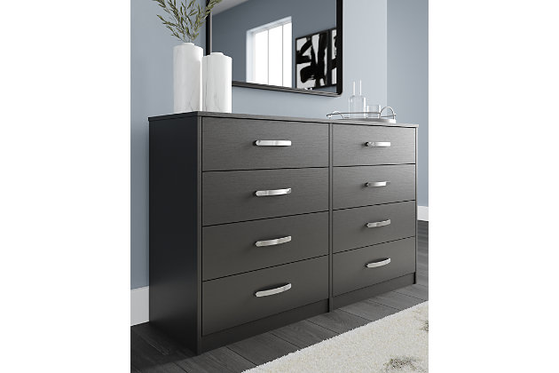Practical and attractive, the Finch 8-drawer dresser blends seamlessly with modern decor and makes a smart addition to a bedroom. The eight full-sized drawers slide easily on metal ball bearings and can be used to keep your clothes neat and organized. Sleek metal pulls in a brushed nickel-tone finish add to the streamlined aesthetic. Combine with other units in the collection to create a room that’s smart and stylish.Made of engineered wood (MDF/particleboard) and decorative laminate | Matte black finish with subtle replicated wood grain | 8 smooth-gliding drawers with ball-bearing construction and safety stops | Vinyl-wrapped drawer sides and back | Brushed nickel-tone hardware | Safety is a top priority, clothing storage units are designed to meet the most current standard for stability, ASTM F 2057 (ASTM International) | Drawers extend out to accommodate maximum access to drawer interior while maintaining safety | Assembly required | Estimated Assembly Time: 50 Minutes