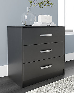 Practical and attractive, the Finch 3-drawer chest blends seamlessly with modern decor and makes a smart addition to a bedroom. The three full-sized drawers slide easily on metal ball bearings and can be used to keep your clothes neat and organized. Sleek metal pulls in a brushed nickel-tone finish add to the streamlined aesthetic. Combine with other units in the collection to create a room that’s smart and stylish.Made of engineered wood and decorative laminate | Matte black finish with subtle replicated wood grain | 3 smooth-gliding drawers with ball-bearing construction and safety stops | Brushed nickel-tone hardware | Safety is a top priority, clothing storage units are designed to meet the most current standard for stability, ASTM F 2057 (ASTM International) | Drawers extend out to accommodate maximum access to drawer interior while maintaining safety | Assembly required | Estimated Assembly Time: 25 Minutes