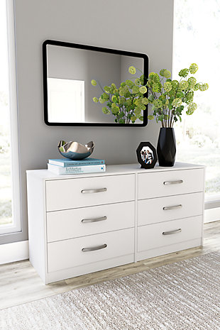 Practical and attractive, the Flannia 6-drawer dresser blends seamlessly with modern decor and makes a smart addition to a bedroom. The six full-sized drawers slide easily on metal ball bearings and can be used to keep your clothes neat and organized. Sleek metal pulls in a brushed nickel-tone finish add to the streamlined aesthetic. Combine with other units in the collection to create a room that’s smart and stylish.Made of engineered wood (MDF/particleboard) and decorative laminate | Solid white in a matte finish | 6 smooth-gliding drawers with ball-bearing construction and safety stops | Vinyl-wrapped drawer sides and back | Brushed nickel-tone hardware | Safety is a top priority, clothing storage units are designed to meet the most current standard for stability, ASTM F 2057 (ASTM International) | Drawers extend out to accommodate maximum access to drawer interior while maintaining safety | Assembly required | Estimated Assembly Time: 50 Minutes