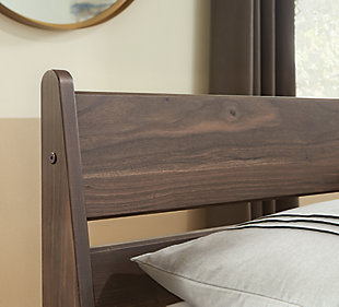 At the intersection of classic cool and chic sophistication you’ll find the Calverson full panel headboard. The rich brown finish over replicated walnut wood grain offers an authentic touch that plays well any way you style it. Minimal yet elegant in its design, this headboard keeps your home decor grounded while elevating your modern style.Headboard only | Made of engineered wood (MDF/particleboard) and decorative laminate | Rich brown finish over replicated walnut wood grain with authentic touch | Hardware not included | ¼" bolts are needed to attach headboard to your existing metal bed frame | Assembly required | Estimated Assembly Time: 15 Minutes