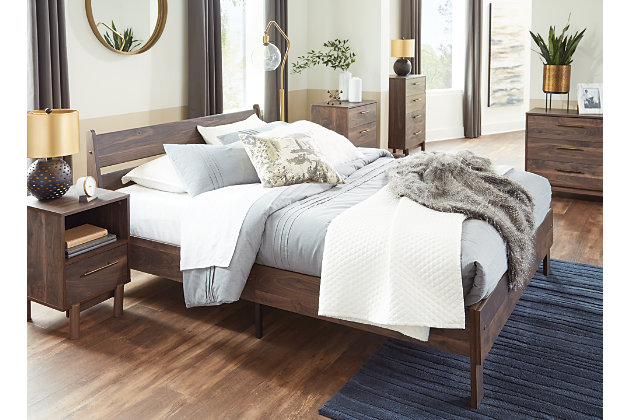 At the intersection of classic cool and chic sophistication you’ll find the Calverson queen panel platform bed. The rich brown finish over replicated walnut wood grain offers an authentic touch that plays well any way you style it. Minimal yet elegant in its design, this bed keeps your home decor grounded while elevating your modern style. Best of all, our innovative bed-in-a-box shipping system delivers your new bed right to the door.Complete queen bed in a box | Includes headboard and platform bed | Made of engineered wood (MDF/particleboard) and decorative laminate | Rich brown finish over replicated walnut wood grain with authentic touch | Bed does not require additional foundation/box spring | Mattress available, sold separately | Assembly required | Estimated Assembly Time: 50 Minutes