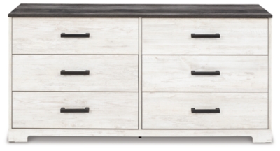 Give provincial a new meaning with the chic look of the Shawburn dresser. The two-tone finish keeps this piece light and fresh while the warm pewter-tone hardware adds an industrial touch. The distressed whitewashed body adds a delightfully homespun charm to your space.Made with engineered wood (MDF/particleboard) and decorative laminate | Whitewash replicated worn through paint | Top with rustic gray planked replicated oak grain with authentic touch | Pewter-tone pulls | 6 smooth-gliding drawers | Vinyl wrapped drawer sides and back for extra durability | Safety is a top priority, clothing storage units are designed to meet the most current standard for stability, ASTM F 2057 (ASTM International) | Drawers extend out to accommodate maximum access to drawer interior while maintaining safety | Assembly required | Estimated Assembly Time: 50 Minutes