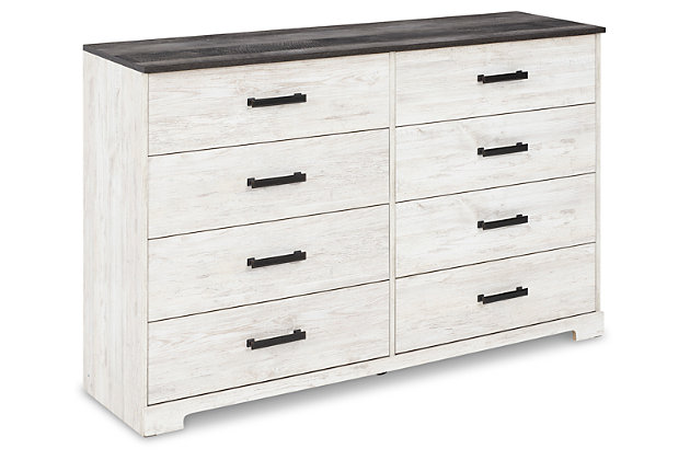 Give provincial a new meaning with the chic look of the Shawburn dresser. The two-tone finish keeps this piece light and fresh while the warm pewter-tone hardware adds an industrial touch. The distressed whitewashed body adds a delightfully homespun charm to your space.Made of engineered wood and decorative laminate | Whitewash replicated worn through paint | Top with rustic gray planked replicated oak grain with authentic touch | Pewter-tone pulls | 8 smooth-gliding drawers | Vinyl-wrapped drawer sides and back for extra durability | Safety is a top priority, clothing storage units are designed to meet the most current standard for stability, ASTM F 2057 (ASTM International) | Drawers extend out to accommodate maximum access to drawer interior while maintaining safety | Assembly required | Estimated Assembly Time: 50 Minutes