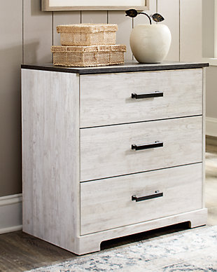 Give provincial a new meaning with the chic look of the Shawburn three-drawer chest. The two-tone finish keeps this piece light and fresh while the warm pewter-tone hardware adds an industrial touch. The distressed whitewashed body adds a delightfully homespun charm to your space.Made of engineered wood and decorative laminate | Whitewash replicated worn through paint | Top with rustic gray planked replicated oak grain with authentic touch | Pewter-tone pulls | 3 smooth-gliding drawers | Vinyl wrapped drawer sides and back for extra durability | Safety is a top priority, clothing storage units are designed to meet the most current standard for stability, ASTM F 2057 (ASTM International) | Drawers extend out to accommodate maximum access to drawer interior while maintaining safety | Assembly required | Estimated Assembly Time: 25 Minutes