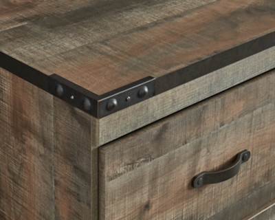 Close-up of corner with metal hardware on wooden furniture