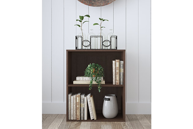 Organize your life and elevate your style with the Camiburg bookcase. Merging clean, crisp lines with a replicated rough sawn wood grain, it’s a simply striking example of modern farmhouse design done right. This farmhouse fresh bookcase includes a single adjustable shelf to accommodate your needs. Be it in your home office, family room or guest room, what a beautiful way to put books and home accents on display.Made of engineered wood and decorative laminate | Replicated rough sawn wood grain | Single adjustable shelf to accommodate your needs | Clean-lined design offers great versatility | Assembly required | Estimated Assembly Time: 30 Minutes