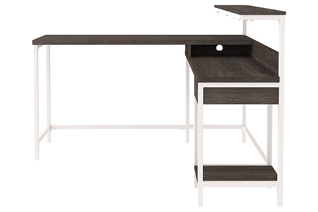 More than just a beauty to behold, this home office L-desk is designed to raise your productivity by packing more work area into less space. Sporting a two-tone finish, it’s ready to take a cool stance for modern farmhouse style. Pair with the bookcase (sold separately) for a well-organized home office.Made of engineered wood and laminated paper | Two-tone treatment; replicated gray wood top with antiqued white base | Combined desk with shelf and return with drawer and fixed shelf | Convenient cubby for additional storage | Designed for easy cord management | Assembly required | Estimated Assembly Time: 120 Minutes