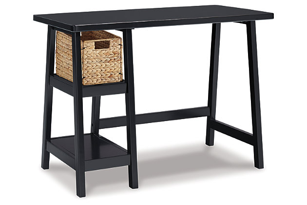 Space-challenged rooms call for simply chic style: like the Mirimyn small home office desk in black. Clean and lean, this desk’s classic trestle design always works. Pair of open shelves and natural water hyacinth basket provide essential storage.Made with solid wood, veneer and engineered wood | Distressed finish | Includes water hyacinth basket | 2 fixed shelves | Assembly required | Estimated Assembly Time: 30 Minutes
