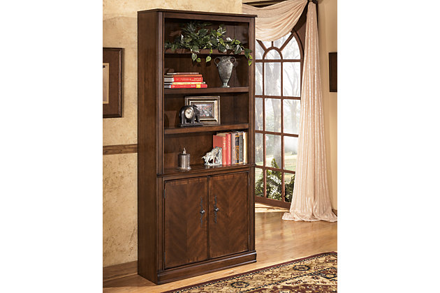 When you mix stately, traditional style with a European flair, you’ve got something special. Case in point: the Hamlyn door bookcase. Simply beautiful, it’s bathed in a richly colored finish for rustic warmth and high-end appeal. Shelving storage behind the dual doors is especially convenient.Hand-finished | Made of veneers, wood and engineered wood | Assembly required | 2 cabinets, each with 1 adjustable shelf | 3 adjustable shelves | Antiqued bronze-tone hardware | Excluded from promotional discounts and coupons