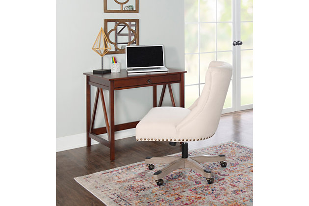 Roll out high style and low maintenance in your home workspace with this upholstered swivel office chair set on casters. Button-tufted upholstered seat is wrapped in hard-working LiveSmart fabric that’s stain resistant, water repellent and designed for heavy wear. And with swivel, gas lift and tilt features, this designer home office chair helps keep you on a roll.Made of pine wood and engineered wood | Gray washed wood base | Cushioned upholstered seat covered in stain-resistant, water-repellent livesmart fabric | Button tufting | Bfm gas lift and tilt plate | Nailhead trim and caster caps with antiqued brass-tone finish | Metal casters | Assembly required