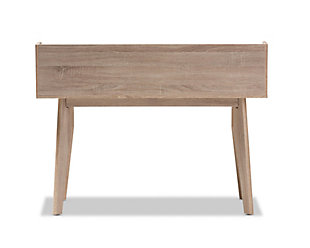 Mid-century design started setting fashion trends in the '50s, and now it’s making a brilliant comeback. With its small scale, this 4-drawer desk fits exceptionally well into tight spaces.  Two-tone oak and gray finishes and distinctive splayed legs evoke its roots while marking it as a chic modern classic. Whether used in the entryway, bedroom or den, this ultra-versatile piece is sure to make a statement.Made of faux veneer and engineered wood | Two-tone oak and gray finishes | 4 drawers with cut-out handles | 2 open storage spaces | Imported | Assembly required