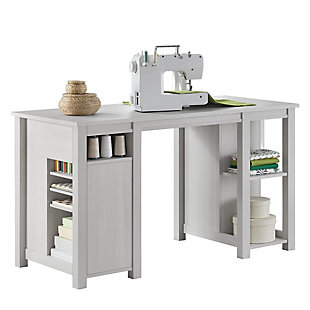 Add a certain charm to your room with this delightful workspace. With an off-white woodgrain finish, this rustic piece is finished on all four sides to allow you to work from any side, and the storage capabilities are endless on the double pedestal base. With plenty of space to work, this versatile desk lets you create from any angle.Made of laminated engineered wood | Off-white woodgrain finish (multiple rustic finishes available) | 2 front drawers for storage | 3 shelves (1 adjustable) behind each door | 2 tool holders located behind the right-side door | Open cubbies and shelves on back and side of the desk | Assembly required (2 adults recommended)