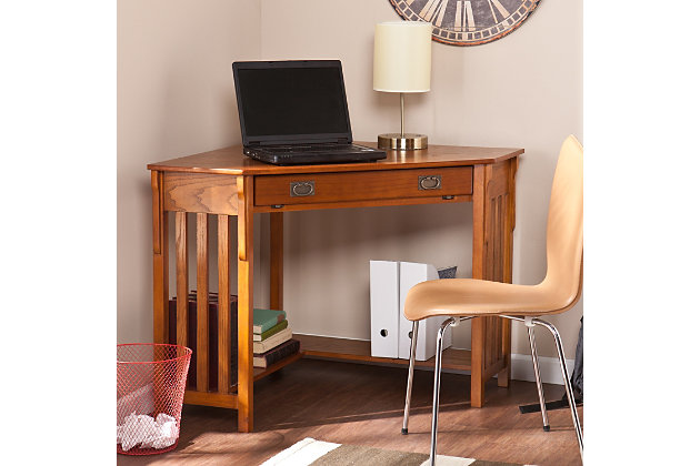 No house is complete in the modern era without a convenient home office. Why settle for a solution that clutters your home when this Craftsman inspired corner desk can save you space and add style? On the top, a circular cord keeper keeps clutter to a minimum. The front drawer folds down to reveal a retractable tray that allows you to store your keyboard and mouse free of dust and out of sight. A lower shelf under the desk is perfect for books, disks or other computer gadgets. Both stylish and practical, this corner computer desk is a must have for every home.Made of wood, veneer and engineered wood | Mission oak finish | Slide out keyboard tray | Open L-shaped storage shelf | Cord management opening on desktop | Space saving solution | Assembly required | Assembly time frame is 15 to 30 min.