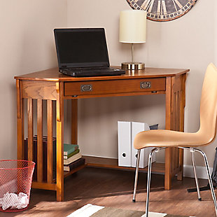 No house is complete in the modern era without a convenient home office. Why settle for a solution that clutters your home when this Craftsman inspired corner desk can save you space and add style? On the top, a circular cord keeper keeps clutter to a minimum. The front drawer folds down to reveal a retractable tray that allows you to store your keyboard and mouse free of dust and out of sight. A lower shelf under the desk is perfect for books, disks or other computer gadgets. Both stylish and practical, this corner computer desk is a must have for every home.Made of wood, veneer and engineered wood | Mission oak finish | Slide out keyboard tray | Open L-shaped storage shelf | Cord management opening on desktop | Space saving solution | Assembly required | Assembly time frame is 15 to 30 min.