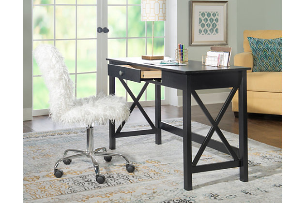 Crisp lines, crisscross paneling and a brilliant black finish make this home office desk an inspired choice for your modern farmhouse. Constructed from solid pine, this piece blends a timeless beauty with long-lasting durability. Pair with other pieces from the collection to establish a cohesive look.Made of pine wood | Black finish | Smooth-gliding drawer | Metal hardware | Assembly required