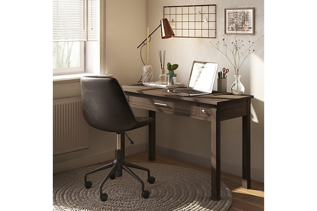 Clean lines and a dark gray finish give this contemporary writing desk a fresh style awakening. Its large surface area is ideal for a monitor, laptop or tablet and leaves enough room for paper, books and other writing accessories. It features a pull-out keyboard tray behind a flip down drawer front plus two side drawers for additional storage space. Ideal for home office or living room settings where it can be used in place of a console or sofa table.Handcrafted of pine wood | Hand-finished with a farmhouse brown finish and a protective nitrocellulose lacquer | 2 side storage drawers with metal drawer glides and brushed nickel-tone pulls | Flip down central drawer front with internal keyboard tray | Elegant square legs and framed sides | Assembly Required