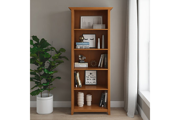The clutter is sometimes overwhelming; books, CD's, mementos, vases, photos, sculptures, office supplies, decor pieces...the list is endless. This bookcase was designed for convenience and versatility with a 70-inch height and four adjustable shelves. Now you can display your books and decorative accents in a dedicated display space and turn your mess into a masterpiece.Handcrafted of pine wood | Hand-finished with a light golden brown stain and a protective nitrocellulose lacquer | Molded crown edged top | 4 adjustable shelves for versatile storage and 1 fixed shelf | Assembly required