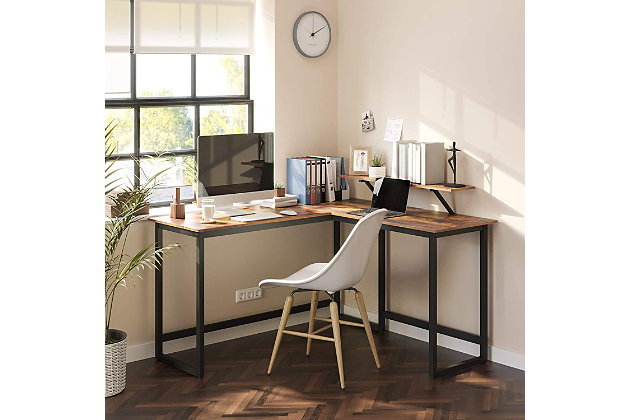 Combining robust materials with a clean, no-frills aesthetic, this L-shaped corner desk with monitor stand makes working hard look easy. Designed for those with an eye for urban industrial and modern rustic furnishings, this simply chic, high-quality desk works on so many levels and can fit right into the scene. With a weight capacity of up to 110 pounds, it’s plenty sturdy—offering room for a printer, reading lamp, stack of books and more. Even better, the monitor stand can be mounted anywhere along the edge of the desk top to suit your space.Made of engineered wood with rustic brown finish | Black steel frame | Monitor stand can be mounted anywhere along the edge of the desk | Holds up to 110 pounds | Assembly required