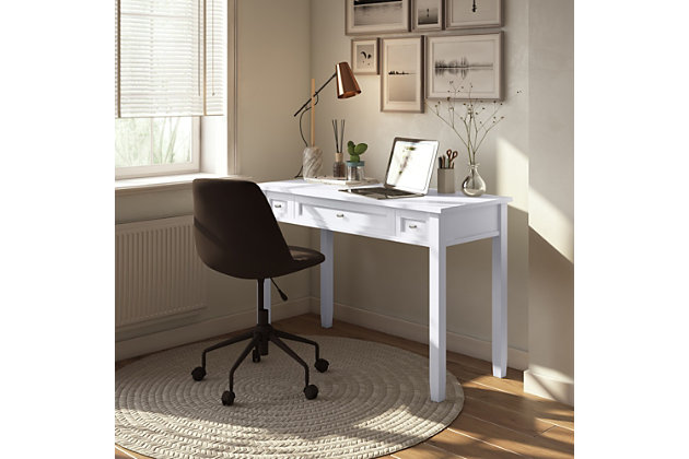 You don't have to avoid going to the office ever again. Enjoy comfortable computing and work from home or office with this Shaker-style desk. Its large surface area is ideal for accommodating a monitor, laptop or tablet, leaving enough room for paper, books and other writing accessories. The desk features a pull-out keyboard tray behind the flip-down drawer front, plus two side drawers for additional storage space.DIMENSIONS: 20" D x 48" W x 31.5" H | Handcrafted with care using the finest quality solid wood | Hand-finished in White with a protective NC lacquer | Multipurpose desk adds function and style without overwhelming the space. Looks great in your living room, family room, home office, bedroom or condo. Provides plenty of space for office work, studying, writing or gaming | Features two side storage drawers with metal drawer glides and a flip down central drawer front with internal keyboard tray | Transitional style features shaker style drawers, Brushed Nickel knobs, square tapered legs and square edged table top | Assembly required | We believe in creating excellent, high quality products made from the finest materials at an affordable price. Every one of our products come with a 1-year warranty and easy returns if you are not satisfied.