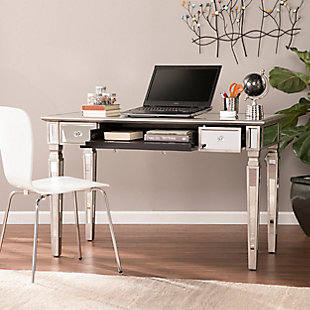 Be fabulous in life and work. Design the perfect lifestyle with this statement-making mirrored desk. Quickly clear your workstation with a pull-out drawer and reveal convenient storage for your keyboard and mouse. Anchoring drawers keep office supplies and mail in their place, and silvertone borders and tapered legs add interesting angles to your home office story. From your dressing area to the home office, this desk works as hard as you do.Made of wood, engineered wood and mirrors | Brushed matte silver color | Fully mirrored for placement anywhere | 2 drawers with crystal embellished knobs; locking keyboard tray | Ample storage; felt-lined drawers protect valuables | Use as a workstation or vanity desk | Assembly required | Assembly time frame is 15 to 30 min.