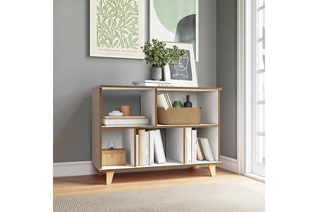 The Minetta bookshelf is a elegant and sophisticated way to store books, travel trinkets and other decor without compromising on mid-century design perfection. Functional with three open shelves and two enclosed spaces, the freestanding bookcase offers ample space for your favorite items. Add some frames up top to spice up this open and airy piece and truly make it your own.Accommodates most flat-panel tvs up to 42" | Includes 3 open shelving spaces and 2 shelves with closed back end | Features all different cubby sizes; cubbies are fixed | White finish | Solid wood splayed legs for fashion and durability | Made with engineered wood | Assembly required