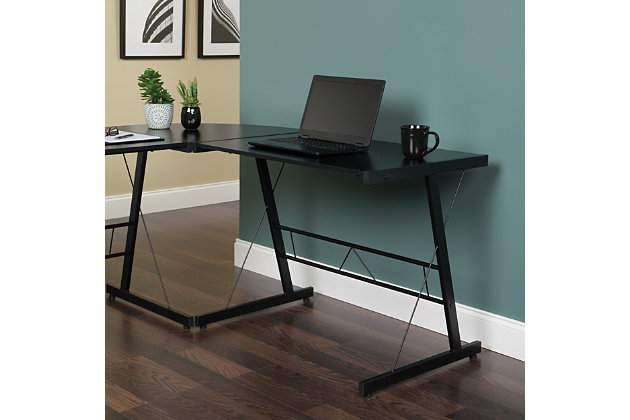 The OFM Essentials Collection is where quality meets value. This industrial modern 60" L-Shaped Desk, Corner Computer Desk, in Black, is perfect for er office spaces and home offices. Featuring a particle board core surrounded by high-quality melamine laminate, the 3/4" thick woodgrain top will wear well and complement your decor. The desk's accent metal legs have a powder coated paint finish, in Black, for durability and adjustable glides for easy surface leveling. The desk is 60" L x 23.625" D Left - 60" L x 23.625" D Right – 29" H.Industrial modern L - shaped desk |  footprint perfect for home and er offices | High quality melamine laminate top | Powder coated industrial metal accent frame | Adjustable glides | OFM Limited Warranty
