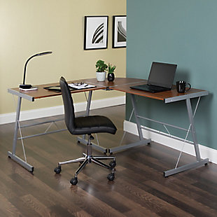 The OFM Essentials Collection is where quality meets value. This industrial modern 60" L-Shaped Desk, Corner Computer Desk, in Walnut, is perfect for smaller office spaces and home offices. Featuring a particle board core surrounded by high-quality melamine laminate, the 3/4" thick woodgrain top will wear well and complement your decor. The desk's accent metal O-frame legs have a powder coated paint finish, in silvertone, for durability and adjustable glides for easy surface leveling. The desk is 60" L x 23.625" D Left - 60" L x 23.625" D Right – 29" H.Industrial modern L - shaped desk | Small footprint perfect for home and smaller offices | High quality melamine laminate top | Powder coated industrial metal accent frame | Adjustable glides | OFM Limited Warranty