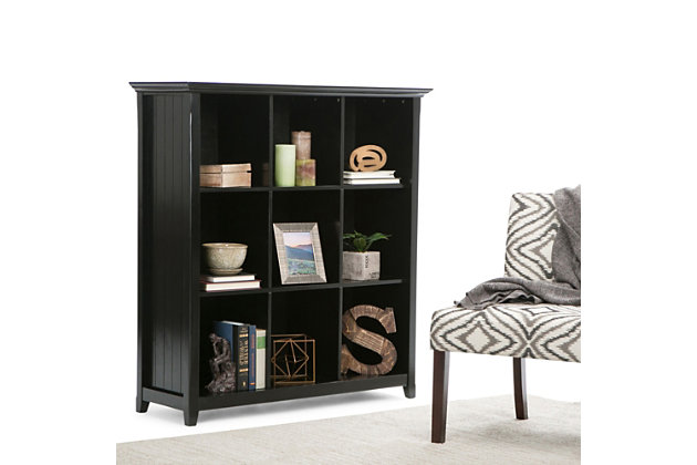 You've been avoiding going into those rooms in your home which are cluttered with books, office supplies, favorite mementos and decor pieces...we can help with that. The Acadian Nine Cube Storage Unit provides the ultimate solution for all of your storage needs. Display your books and decorative accents on dedicated display space for a clean, distinctive cubby look. The stable, attractive design has nine fixed shelves that have exceptional structural strength and durability.; Efforts are made to reproduce accurate colors, variations in color may occur due to computer monitor and photography; At Simpli Home we believe in creating excellent, high quality products made from the finest materials at an affordable price. Every one of our products come with a 1-year warranty and easy returns if you are not satisfiedDIMENSIONS: 15.75" d x 44" w x 48" h | Handcrafted with care using the finest quality solid wood | Hand-finished in Black with a protective NC lacquer | Features twelve (12) large storage cubbies for storage of objects of all shapes and sizes | Multipurpose  unit offers plenty of functional storage. Looks great in your living room, entryway, bedroom, condo or office | Transitional style includes elegantly tapered legs, grooved sides and molded crown edged table top | Assembly Required | We believe in creating excellent, high quality products made from the finest materials at an affordable price. Every one of our products come with a 1-year warranty and easy returns if you are not satisfied.