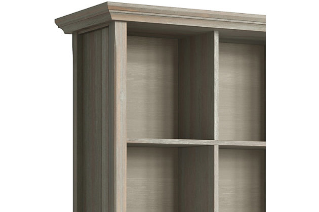 You've been avoiding going into those rooms in your home which are cluttered with books, office supplies, favorite mementos and decor pieces...we can help with that. The Acadian Nine Cube Storage Unit provides the ultimate solution for all of your storage needs. Display your books and decorative accents on dedicated display space for a clean, distinctive cubby look. The stable, attractive design has nine fixed shelves that have exceptional structural strength and durability.; Efforts are made to reproduce accurate colors, variations in color may occur due to computer monitor and photography; At Simpli Home we believe in creating excellent, high quality products made from the finest materials at an affordable price. Every one of our products come with a 1-year warranty and easy returns if you are not satisfiedDIMENSIONS: 15.75" d x 44" w x 48" h | Handcrafted with care using the finest quality solid wood | Hand-finished with a Distressed Grey finish and a protective NC lacquer to accentuate and highlight the grain and the uniqueness of each piece of furniture. | Features twelve (12) large storage cubbies for storage of objects of all shapes and sizes | Multipurpose  unit offers plenty of functional storage. Looks great in your living room, entryway, bedroom, condo or office | Transitional style includes elegantly tapered legs, grooved sides and molded crown edged table top | Assembly Required | We believe in creating excellent, high quality products made from the finest materials at an affordable price. Every one of our products come with a 1-year warranty and easy returns if you are not satisfied.